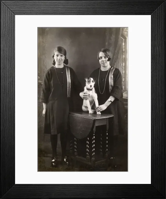 Framed Print : Studio portrait, two girls with terrier