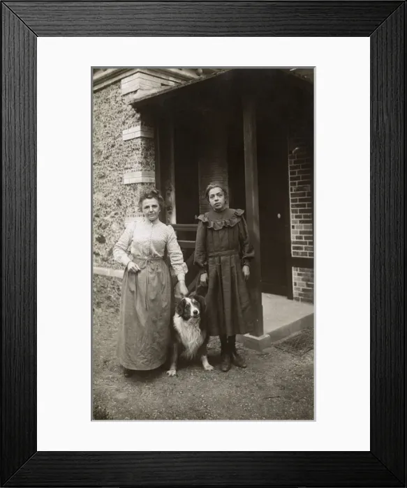 Framed Print : Woman and girl with sheepdog outside a house, France Framed Print : Woman and girl with sheepdog outside a house, France