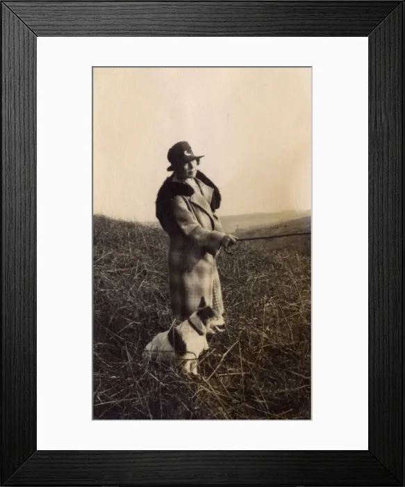 Framed Print : Woman out walking with terrier dog Framed Print : Woman out walking with terrier dog