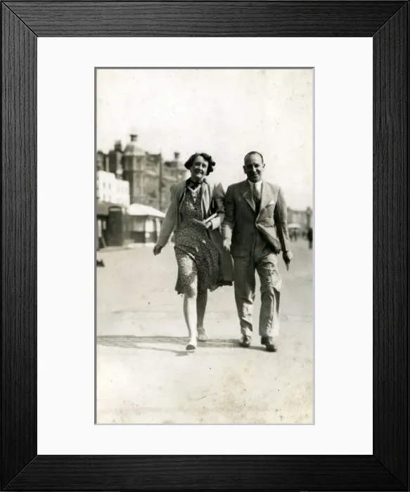Framed Print : Holidaymaker Couple, Weymouth, Dorset Framed Print : Holidaymaker Couple, Weymouth, Dorset