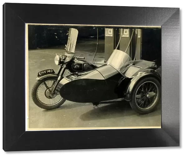 AJS  /  A J Stevens British Motorcycle & Sidecar at a Garage, En