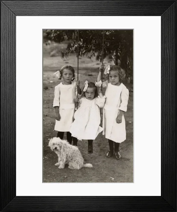 Framed Print : Three little girls with a terrier dog in a garden Framed Print : Three little girls with a terrier dog in a garden