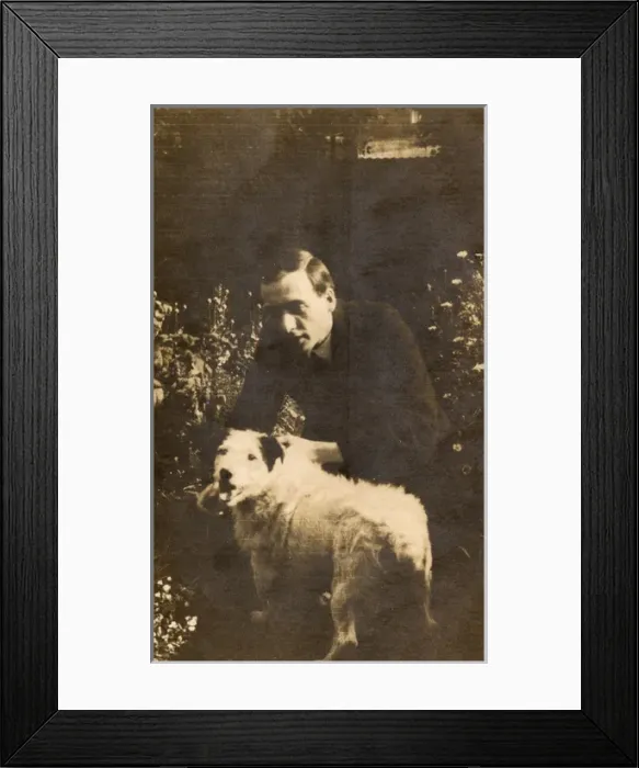 Framed Print : Man with a terrier in a garden Framed Print : Man with a terrier in a garden