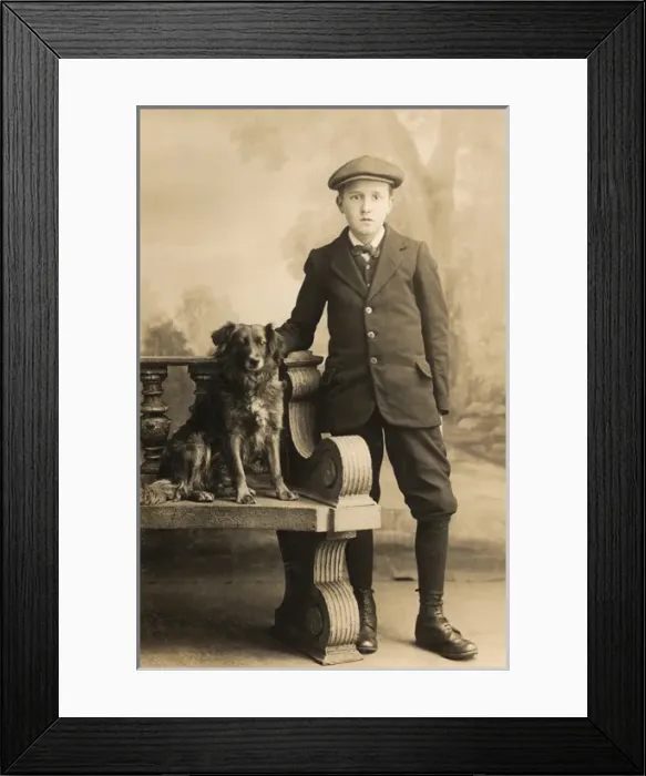 Framed Print : Studio portrait, boy with a dog Framed Print : Studio portrait, boy with a dog