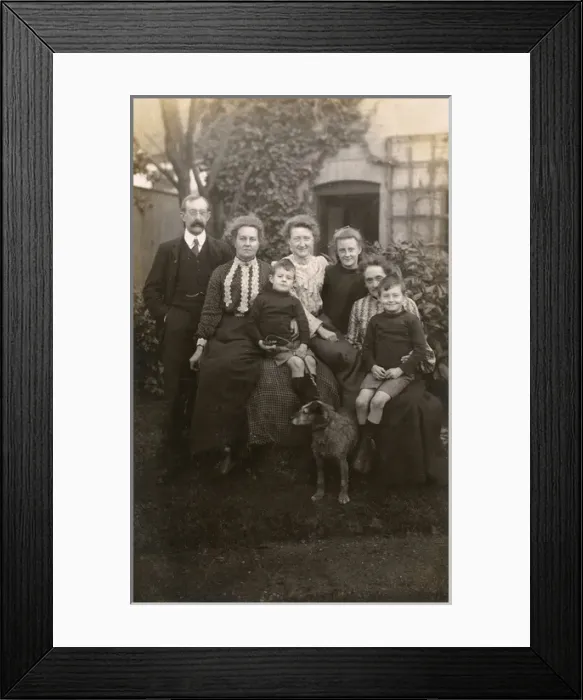 Framed Print : Family of seven with a dog in a garden Framed Print : Family of seven with a dog in a garden