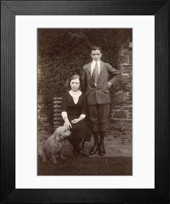 Framed Print : Girl and boy with a dog in a garden Framed Print : Girl and boy with a dog in a garden