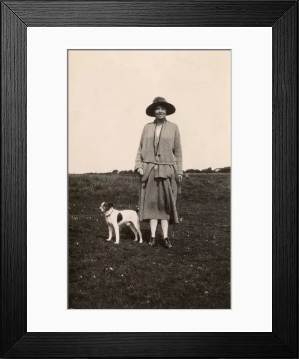 Framed Print : Woman out walking with a dog, Eastbourne, Sussex Framed Print : Woman out walking with a dog, Eastbourne, Sussex