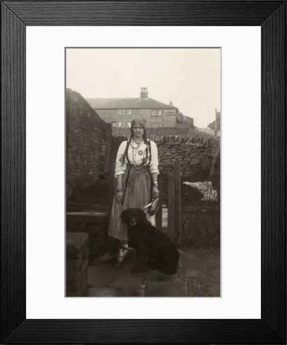 Framed Print : Woman in gipsy costume with a dog in a garden Framed Print : Woman in gipsy costume with a dog in a garden