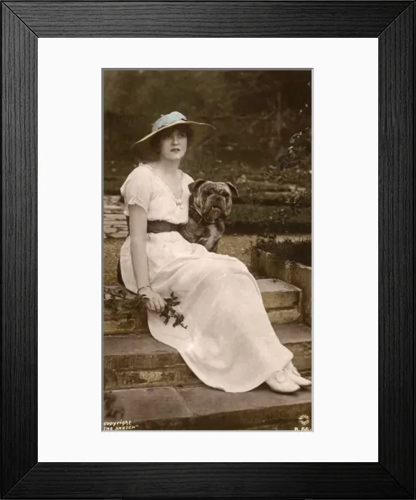 Framed Print : Gabrielle Ray, English actress, with a dog in a garden Framed Print : Gabrielle Ray, English actress, with a dog in a garden
