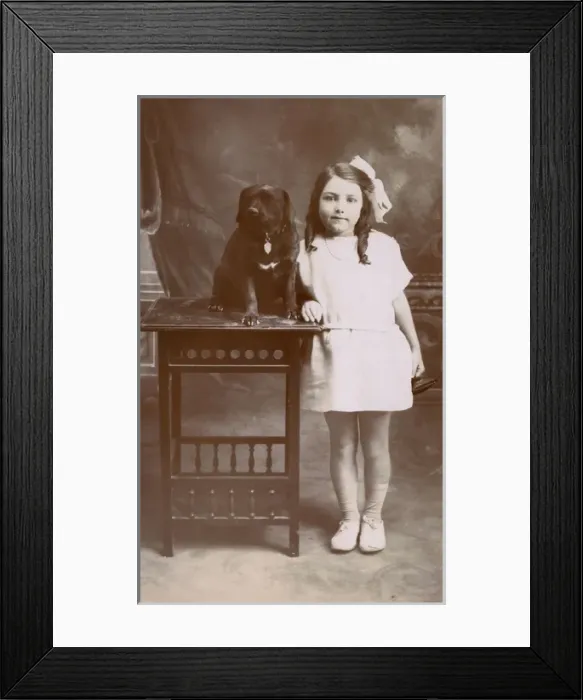 Framed Print : Studio portrait, little girl with her dog Framed Print : Studio portrait, little girl with her dog