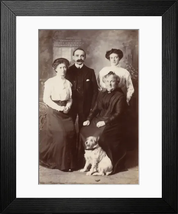 Framed Print : Studio portrait, family of four with terrier dog Framed Print : Studio portrait, family of four with terrier dog