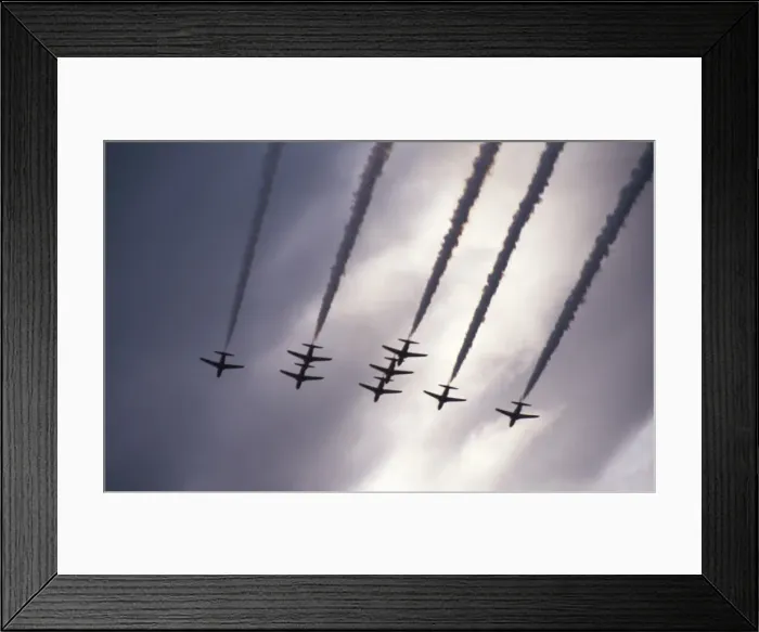 Framed Print : BAe Systems Hawks RAF Red Arrows perform under dark skies Framed Print : BAe Systems Hawks RAF Red Arrows perform under dark skies