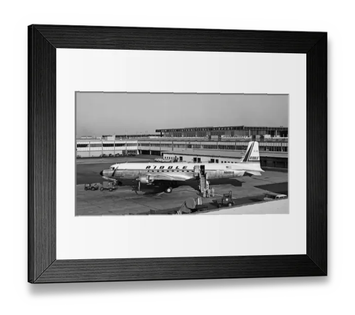 Framed Print : Douglas DC-7CF of Riddles N8215H at Idlewild, later JF Framed Print : Douglas DC-7CF of Riddles N8215H at Idlewild, later JF