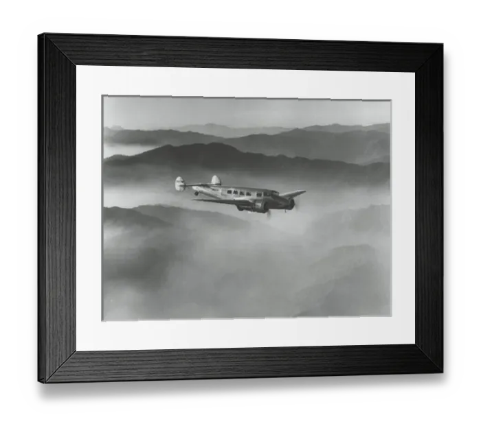 Framed Print : Lockheed L-10 Electra above misty hills Framed Print : Lockheed L-10 Electra above misty hills