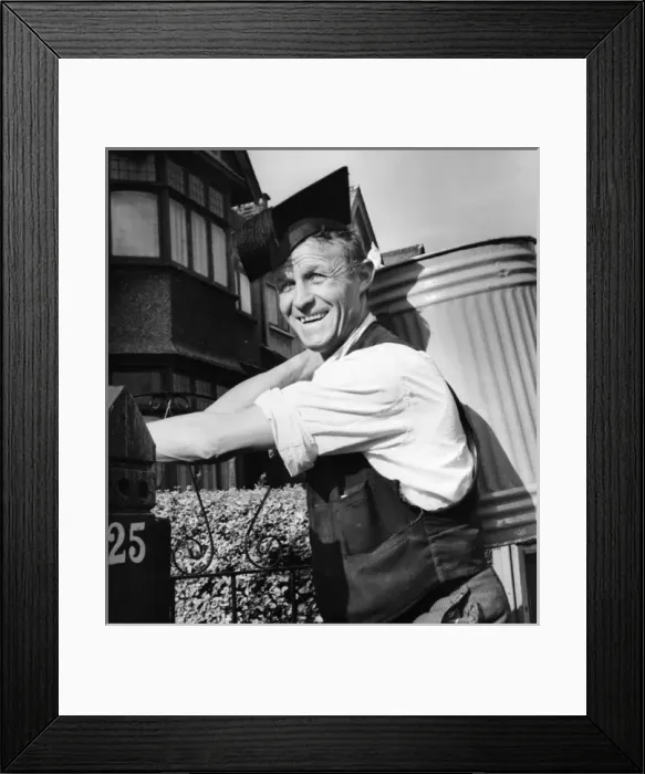 Framed Print : Refuse collector at work on a Balham street, SW London Framed Print : Refuse collector at work on a Balham street, SW London