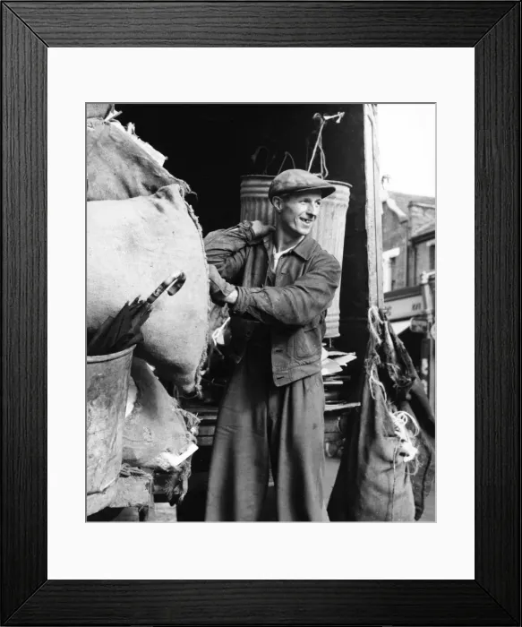 Framed Print : Refuse collector at work on a Balham street, SW London Framed Print : Refuse collector at work on a Balham street, SW London