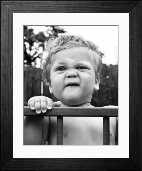 Framed Print : Toddler in a playpen in a garden Framed Print : Toddler in a playpen in a garden