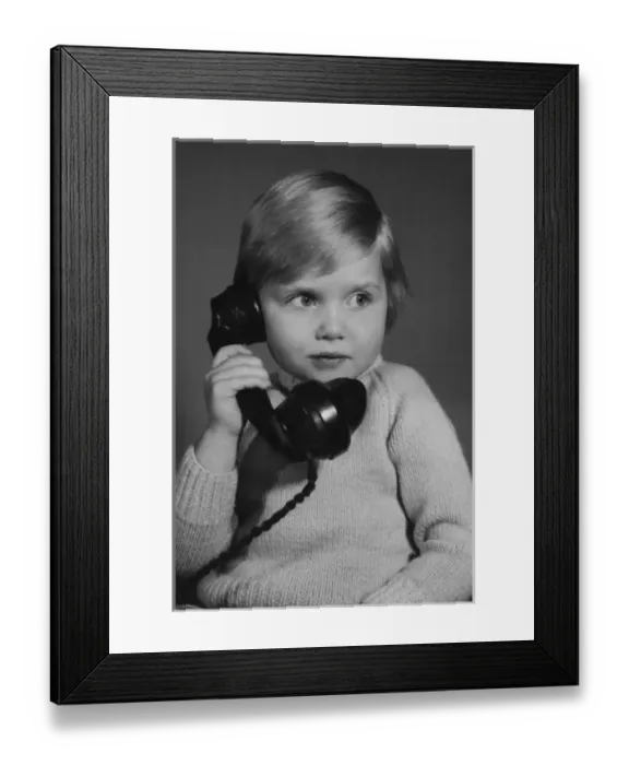 Framed Print : Studio portrait, little boy on the phone Framed Print : Studio portrait, little boy on the phone