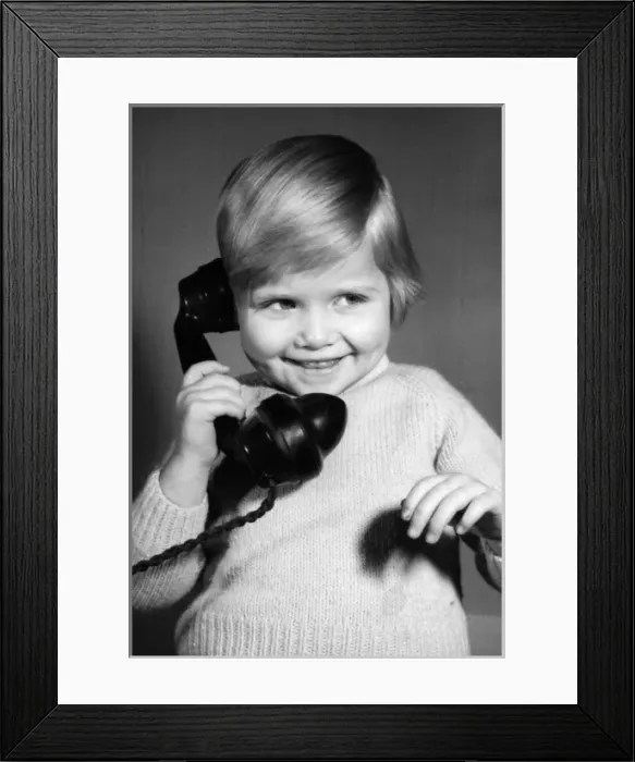 Framed Print : Studio portrait, little boy on the phone Framed Print : Studio portrait, little boy on the phone