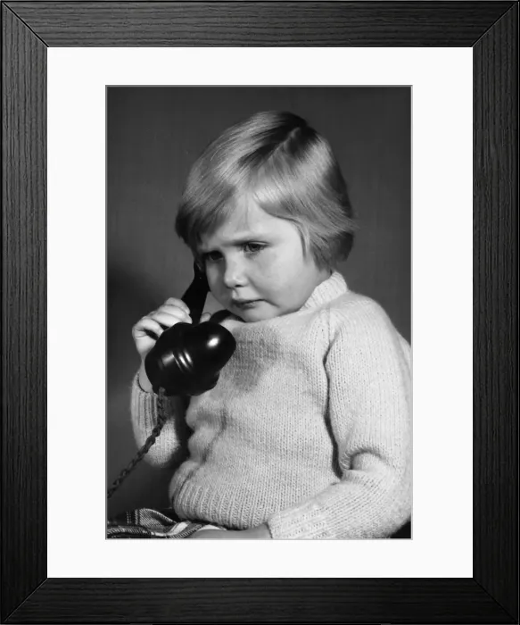 Framed Print : Studio portrait, little boy on the phone Framed Print : Studio portrait, little boy on the phone