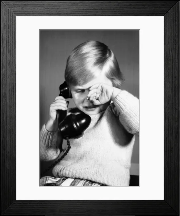 Framed Print : Studio portrait, little boy on the phone Framed Print : Studio portrait, little boy on the phone
