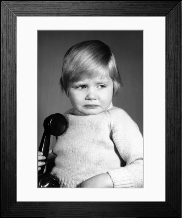 Framed Print : Studio portrait, little boy on the phone Framed Print : Studio portrait, little boy on the phone