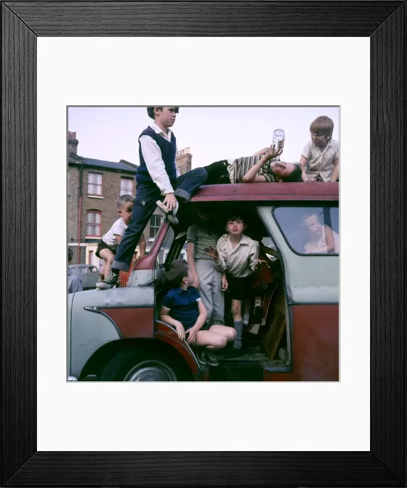Framed Print : Children playing with a van in a Balham street, SW London Framed Print : Children playing with a van in a Balham street, SW London