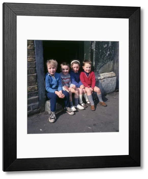 Framed Print : Children on doorstep in a Balham street, SW London Framed Print : Children on doorstep in a Balham street, SW London