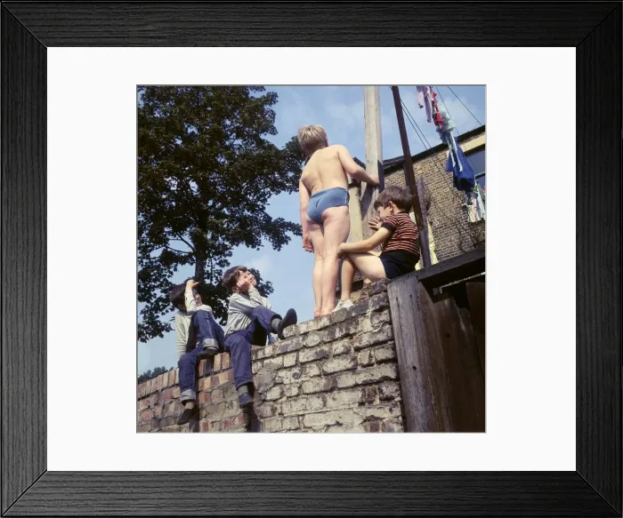 Framed Print : Four boys on a wall, with washing, Balham, SW London Framed Print : Four boys on a wall, with washing, Balham, SW London