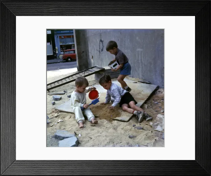 Framed Print : Three boys playing with sand in a Balham street, SW London Framed Print : Three boys playing with sand in a Balham street, SW London