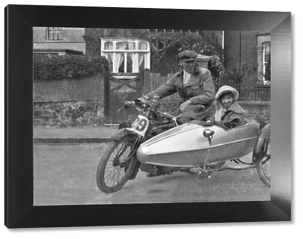 Couple with motorbike and sidecar