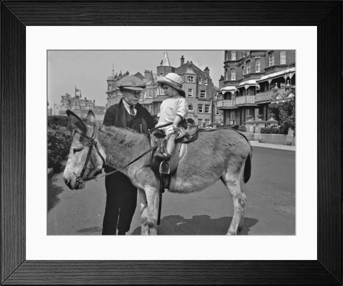 Framed Print : Two children with a donkey at the seaside Framed Print : Two children with a donkey at the seaside