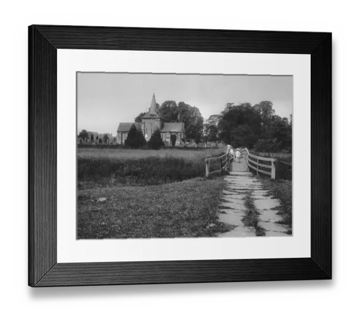 Framed Print : Girl and toddler on a bridge near a church Framed Print : Girl and toddler on a bridge near a church
