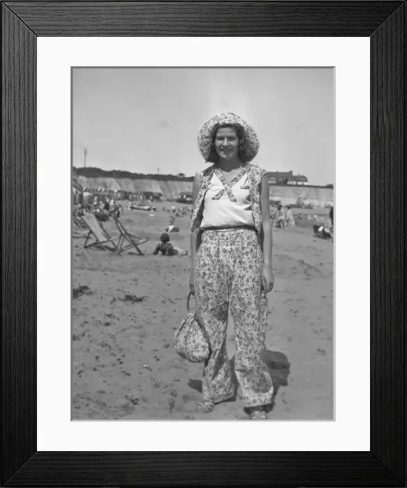 Framed Print : Woman on a beach at a seaside resort, 1930s Framed Print : Woman on a beach at a seaside resort, 1930s