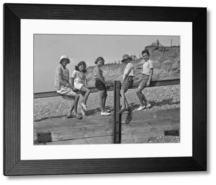 Framed Print : Five children on a breakwater at the seaside Framed Print : Five children on a breakwater at the seaside