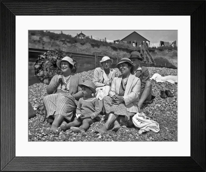 Framed Print : Family group on a pebbly beach at the seaside Framed Print : Family group on a pebbly beach at the seaside