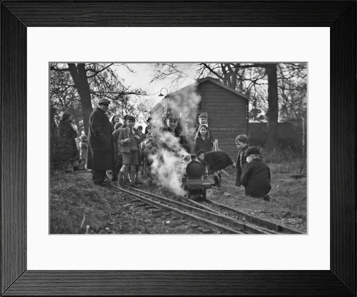 Framed Print : Children gathered around a miniature train Framed Print : Children gathered around a miniature train
