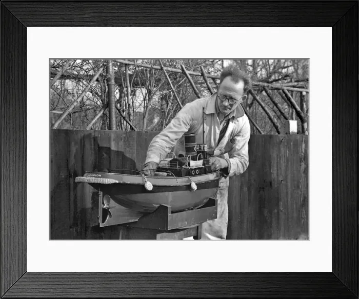 Framed Print : Man making model boat in garden Framed Print : Man making model boat in garden