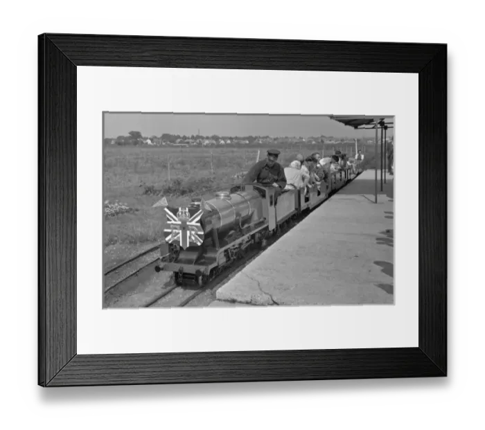 Framed Print : People riding on a miniature steam train Framed Print : People riding on a miniature steam train
