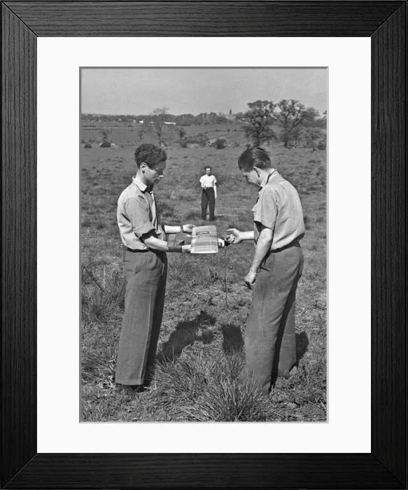 Framed Print : Three men with model plane in a field Framed Print : Three men with model plane in a field