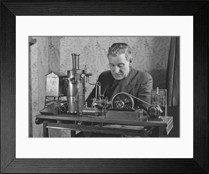 Framed Print : Man working on miniature steam engine Framed Print : Man working on miniature steam engine