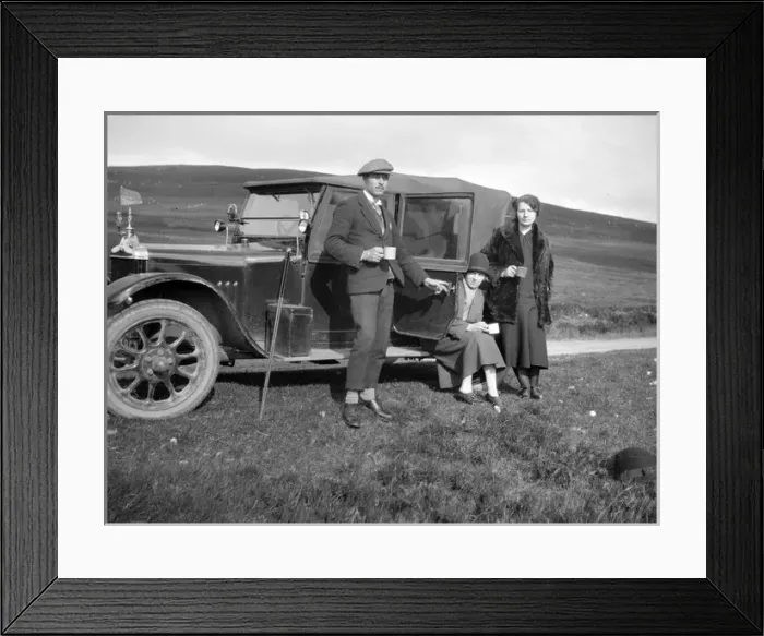 Framed Print : Three people resting at the side of their car Framed Print : Three people resting at the side of their car