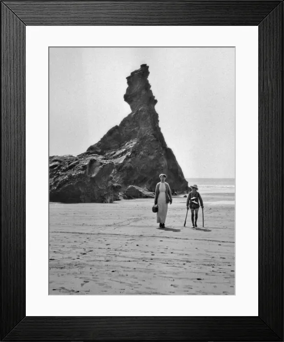 Framed Print : Woman and boy walking on a beach Framed Print : Woman and boy walking on a beach