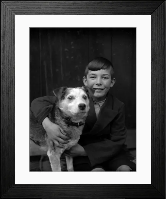 Framed Print : A smiling boy and his terrier dog Framed Print : A smiling boy and his terrier dog