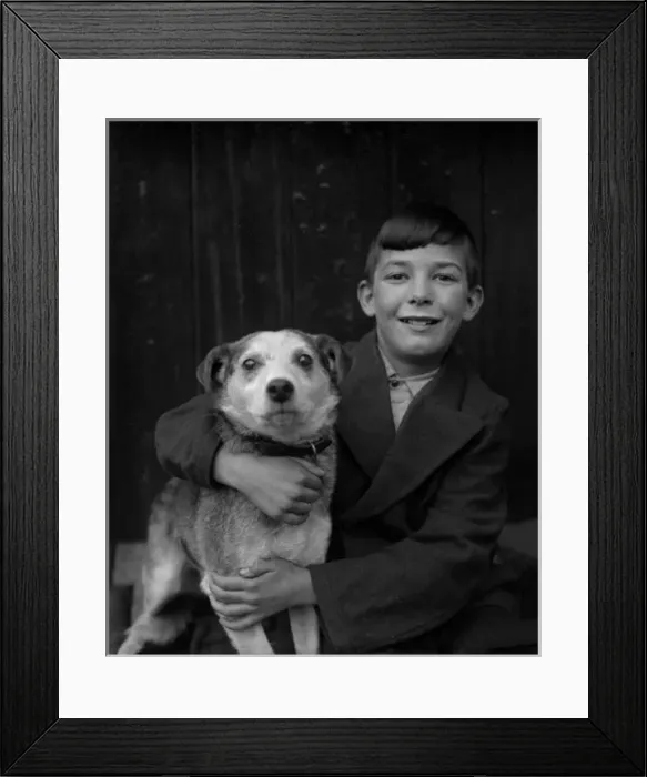 Framed Print : A smiling boy and his terrier dog Framed Print : A smiling boy and his terrier dog