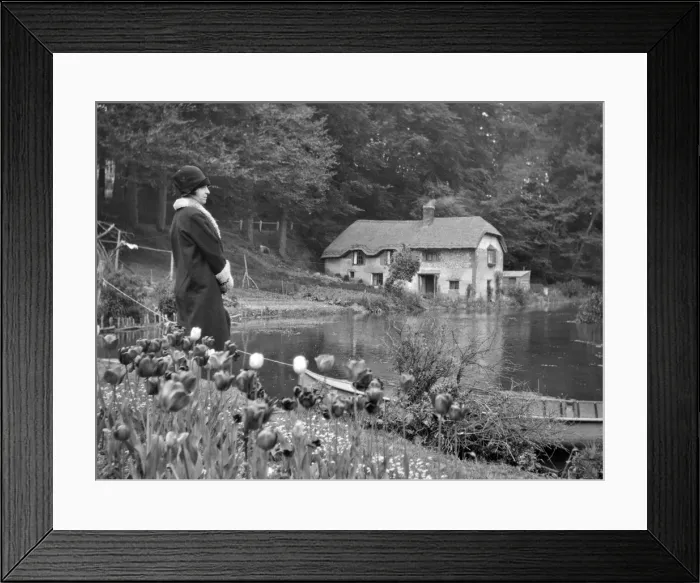 Framed Print : Woman standing by a lake Framed Print : Woman standing by a lake