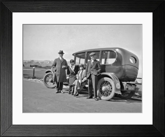 Framed Print : Four people relaxing by their car at the roadside Framed Print : Four people relaxing by their car at the roadside
