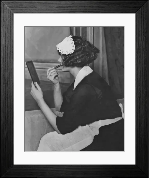 Framed Print : Maid applying lipstick Framed Print : Maid applying lipstick