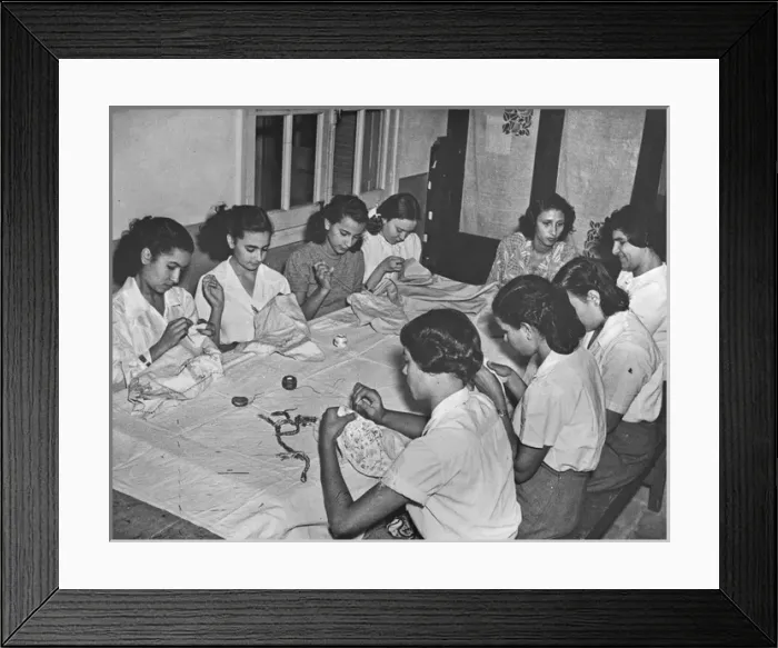 Framed Print : Women sitting at a table sewing Framed Print : Women sitting at a table sewing