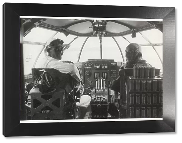 Two men at the controls of a Sunderland flying boat